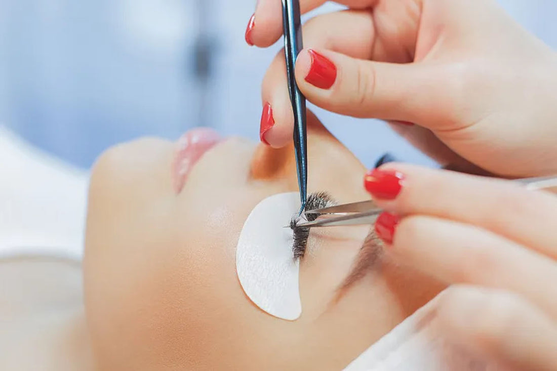 A woman is getting eyelash extensions